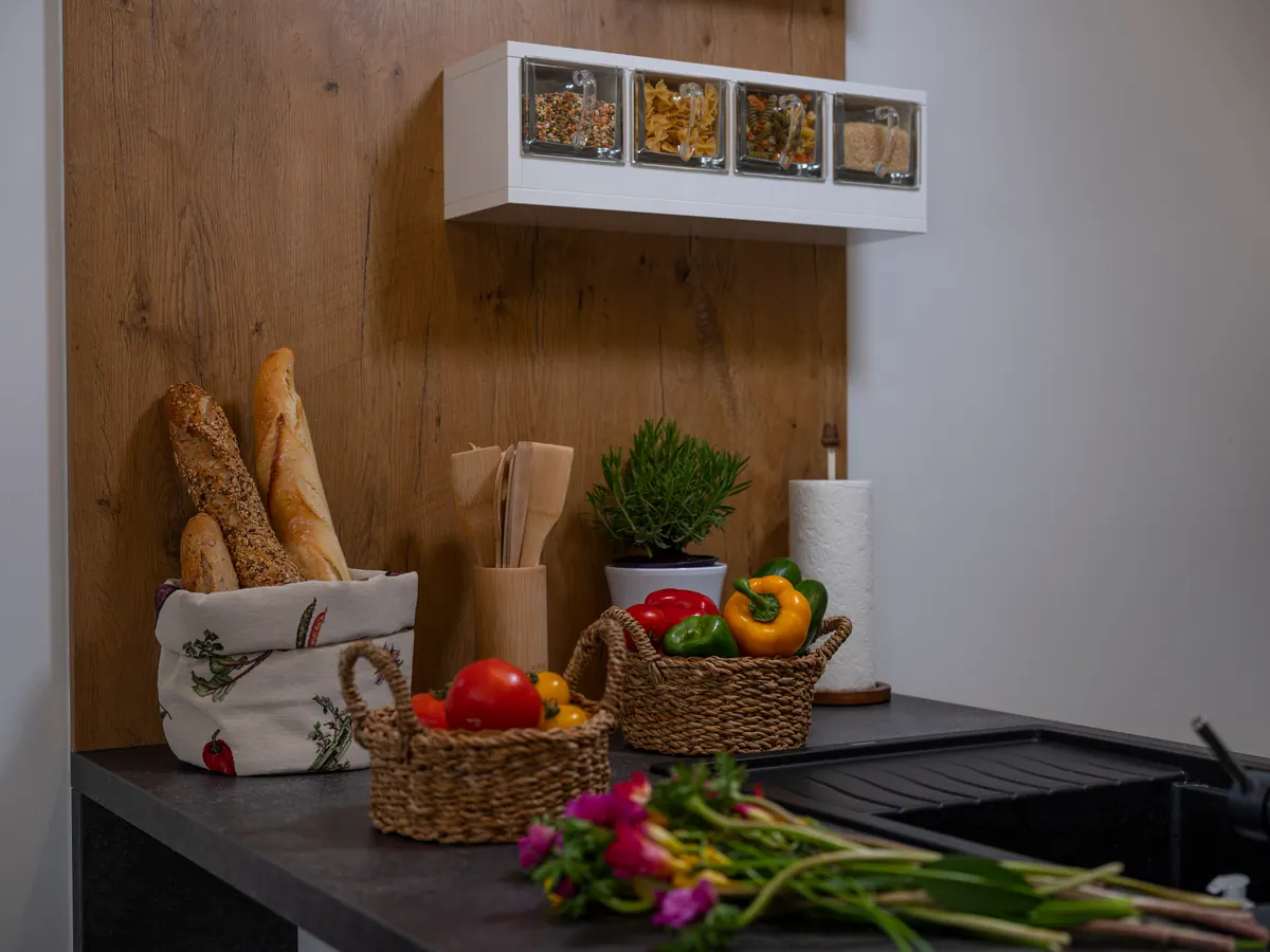 Fresh bread and vegetables on the kitchen counter